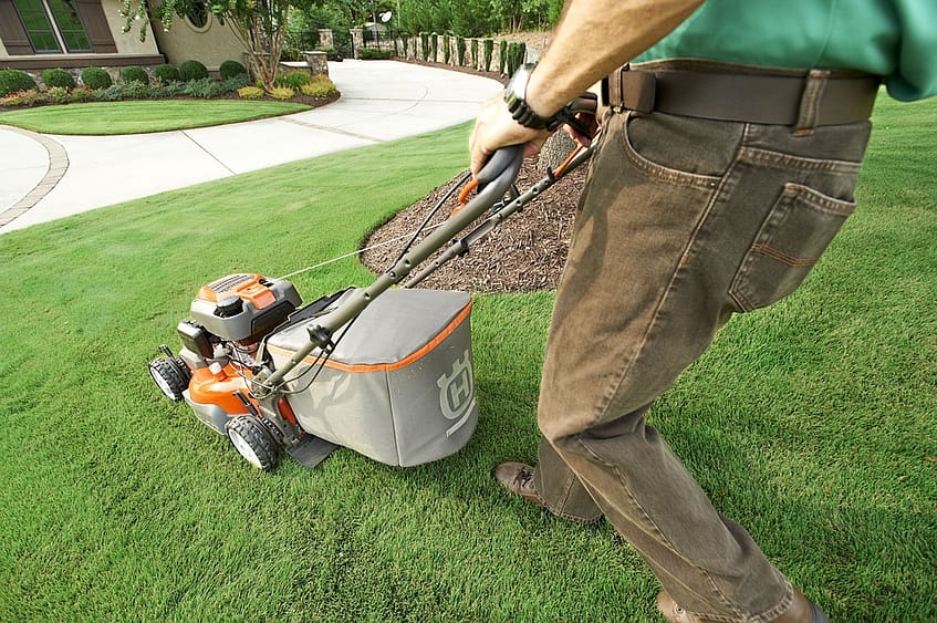man using mowers